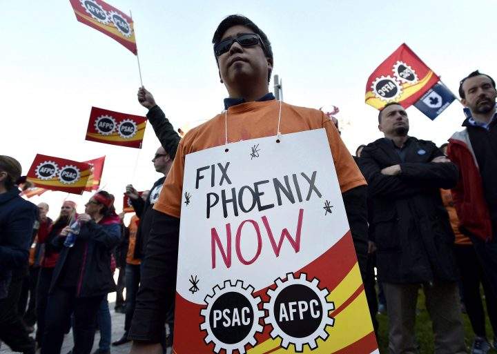 Public servants protest over problems with the Phoenix pay system outside the Office of the Prime Minister and Privy Council in Ottawa on October 12, 2017. 