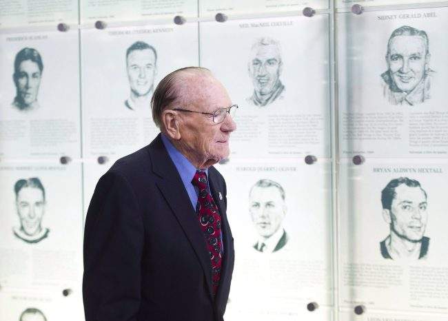 Johnny Bower walks to his seat as The Hockey Hall of Fame officially unveiled the “Esso Great Wall” as home to the Stanley Cup, all major NHL trophies and recognition structures for individuals elected into Honoured Membership in Toronto on March 9, 2012.