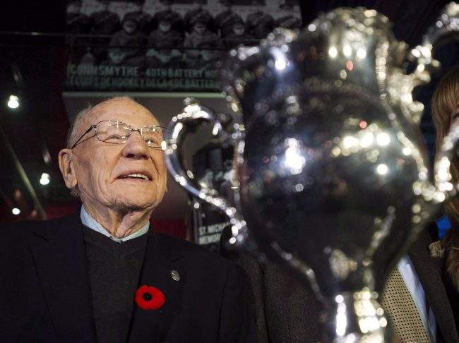 Johnny Bower is seen next to the Memorial Cup at the Hockey Hall of Fame in Toronto on Nov. 10, 2014.