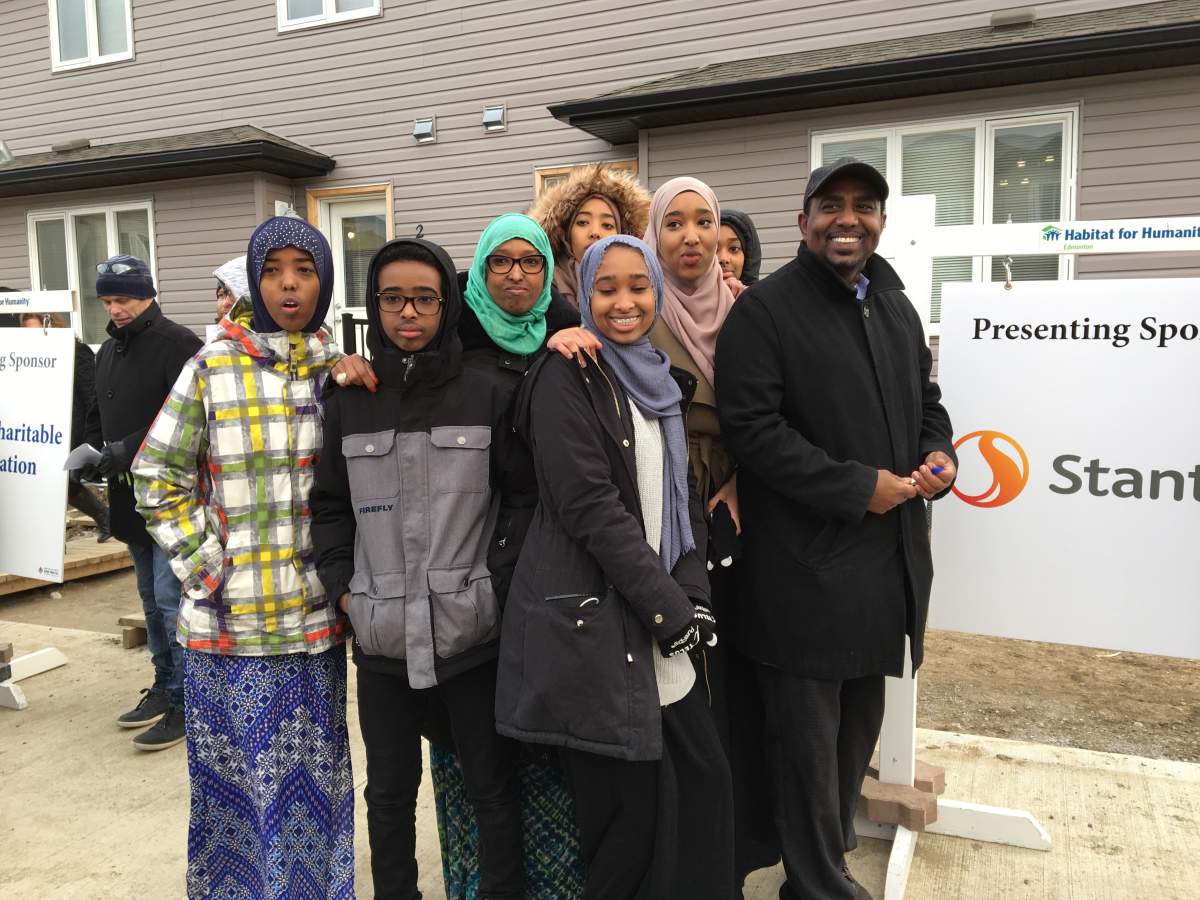 Abdikarim Bakal and his family were the first to receive keys to their new Habitat for Humanity Carter Work Project home on Dec. 21, 2017.