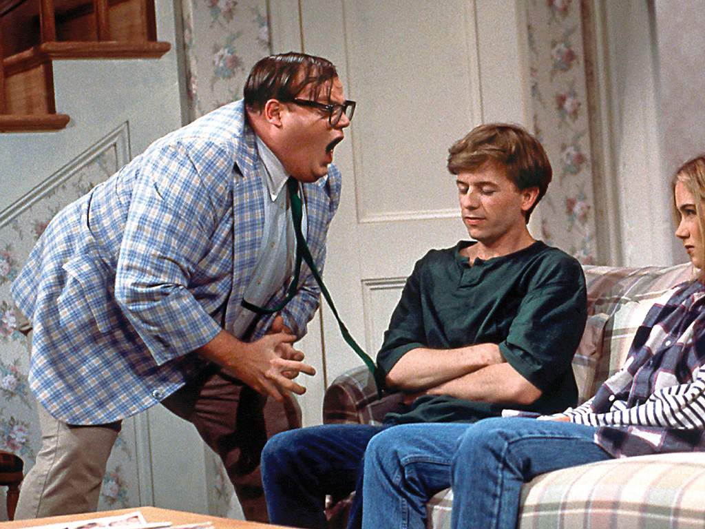 Chris Farley, David Spade and Christina Applegate appear in the 'Motivational Speaker' sketch on 'SNL.'.