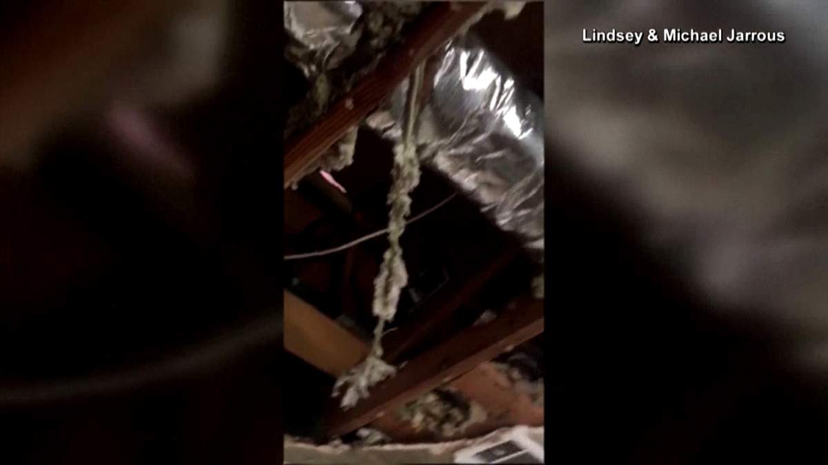 A still image from video of damage done to the home of Lindsey and Michael Jarrous in California after a fire crew had to enter the home to fight a fire in the attic, but weight of the water caused the roof to fall into the bedroom.