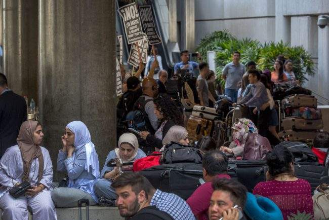 Activists demonstrate as international travelers arrive at Los Angeles International Airport, June 29, 2017 in Los Angeles, California. 



