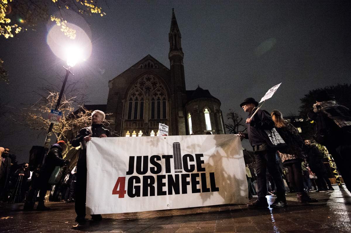 Local people seen holding a large banner bearing the slogan ‘Justice for Grenfell’ during the monthly silent march for the Grenfell Tower fire victims.(Photo by Brais G Rouco/SOPA Images/LightRocket via Getty Images)