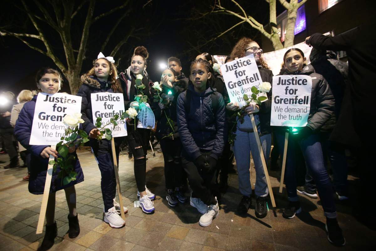 People take part in a silent walk to mark the six month anniversary of the Grenfell Tower fire, in west London. (Photo by Yui Mok/PA Images via Getty Images)