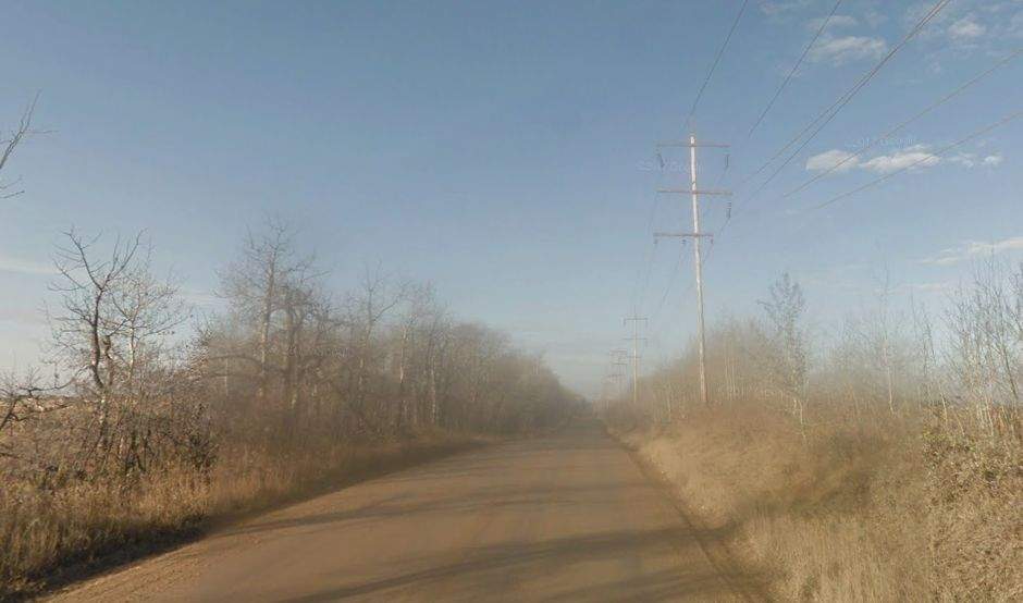 A Google Streetview image of Highway 628, taken west of the intersection with Highway 60 where the road turns to gravel. Dust kicked up from the Google car can be seen in the image. (Sept. 2016)
