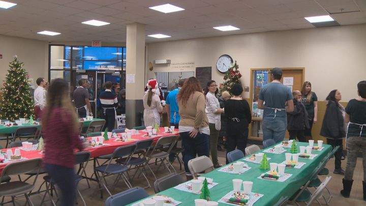 Staff and volunteers at Edmonton’s Hope Mission get ready to welcome hungry people arriving at their Christmas Banquet on Dec. 4, 2017.