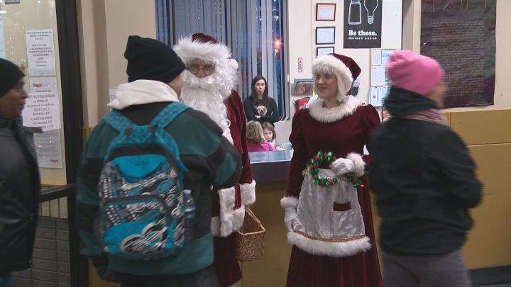 Mr. and Mrs. Claus welcome people arriving at the Hope Mission’s Christmas Banquet on Dec. 4, 2017.