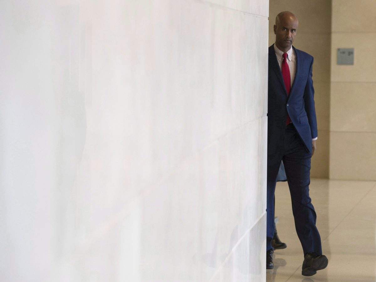 Minister of Immigration, Refugees and Citizenship Ahmed Hussen makes his way to appear before the Commons Citizenship and Immigration committee in Ottawa, Thursday November 23, 2017. 