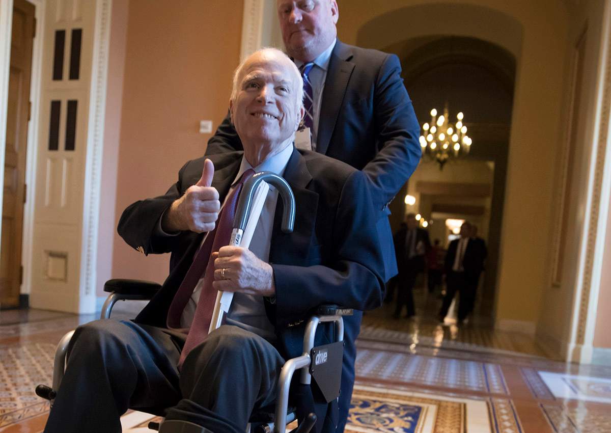 In this Dec. 1, 2017 file photo, Sen. John McCain, R-Ariz., leaves a closed-door session where Republican senators met on the GOP effort to overhaul the tax code, on Capitol Hill in Washington.