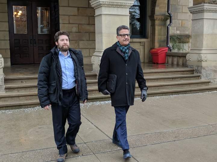 Mark Phillips, the man accused in a baseball bat attack in St. Thomas, leaves the Elgin County Courthouse with his lawyer Steven Sturka.