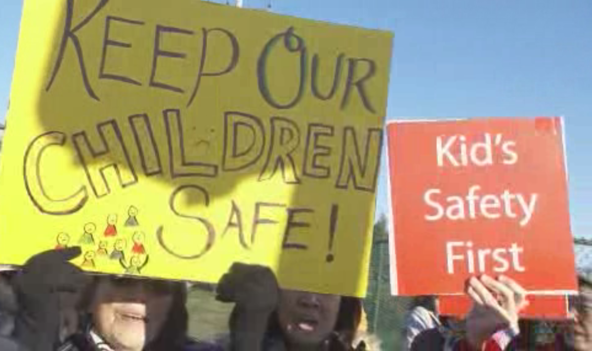Protesters against a temporary housing project for the homeless to be located in Marpole.