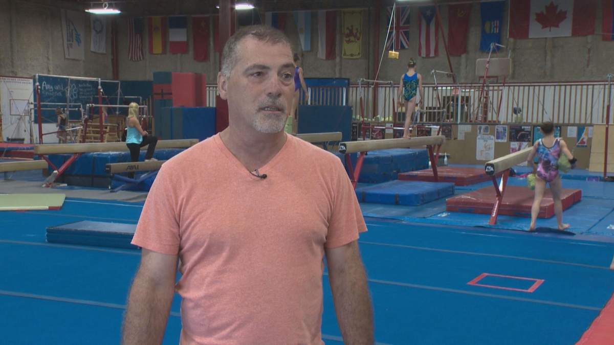 Michel Arsenault speaking to Global Edmonton in a 2014 feature on a young gymnast. 