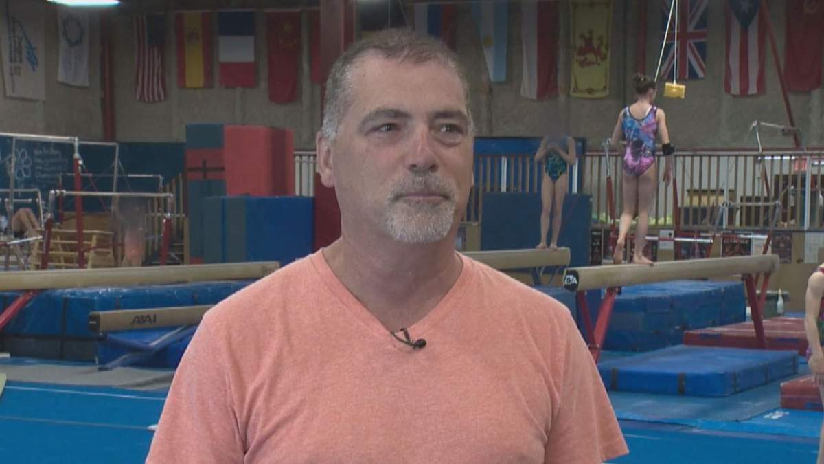 Michel Arsenault speaking to Global Edmonton in a 2014 feature on a young gymnast.
