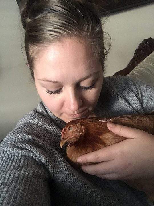 Nikki Pike finds comfort in cuddling with her therapy hen.