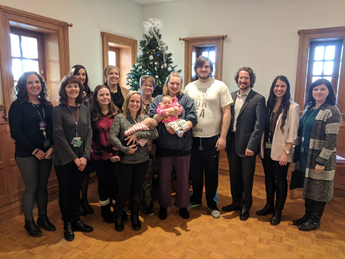 (L-R): Nurses Jody Shepherd and Janis Dowswell, with Program Manager Jennifer Proulx, Director of Health Start Heather Lokko, Celina, Brooklynn and Paisley Stricler with Nurse Jane Berardini. Emily Berryhill with her baby Octavia, fiance Gordon Crowder, MLHU CEO Dr. Christopher Mackie, Nurse Becki Bohdanowicz and Program Assistant Trish Husband. 