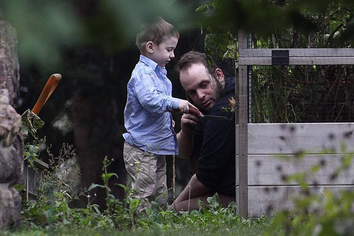 Joshua Boyle and his son Jonah play in the garden at his parent’s house in Smiths Falls, Ontario, on Oct., Saturday 14, 2017.
