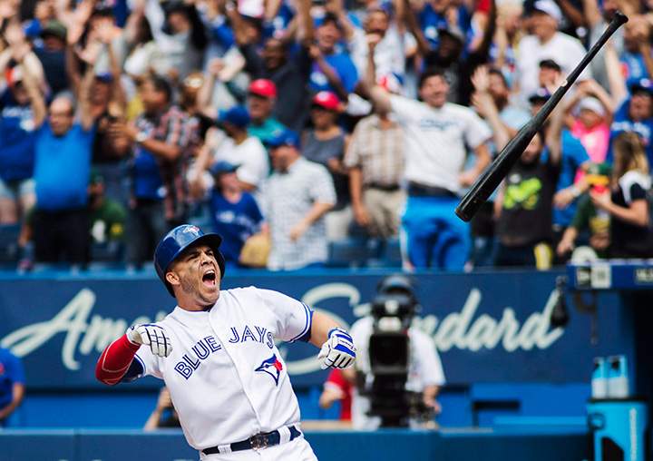 Toronto Blue Jays Steve Pearce throws his bat in celebration after hitting a walk off grand slam to beat the Oakland Athletics during the 10th inning in Toronto, Thursday July 27, 2017.