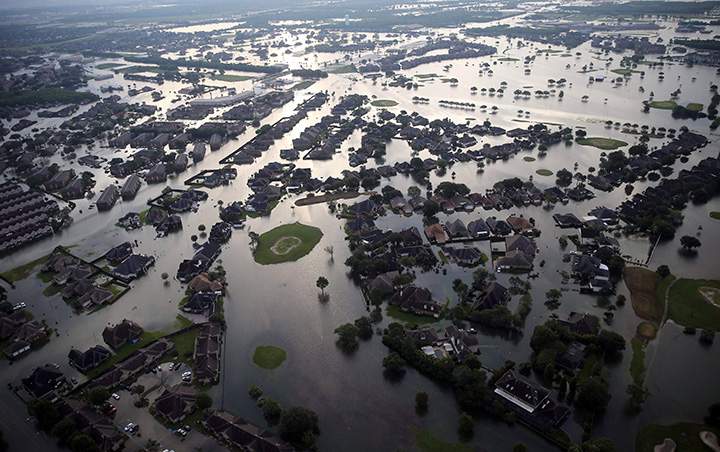 Floodwaters from Tropical Storm Harvey surround homes in Port Arthur, Texas, on Aug. 31, 2017.
