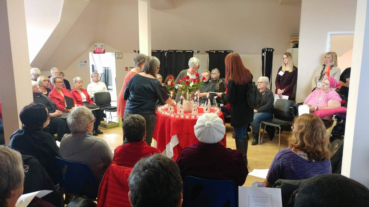 The names of women and girls who have suffered violence are said aloud as canles were lit in their honour.