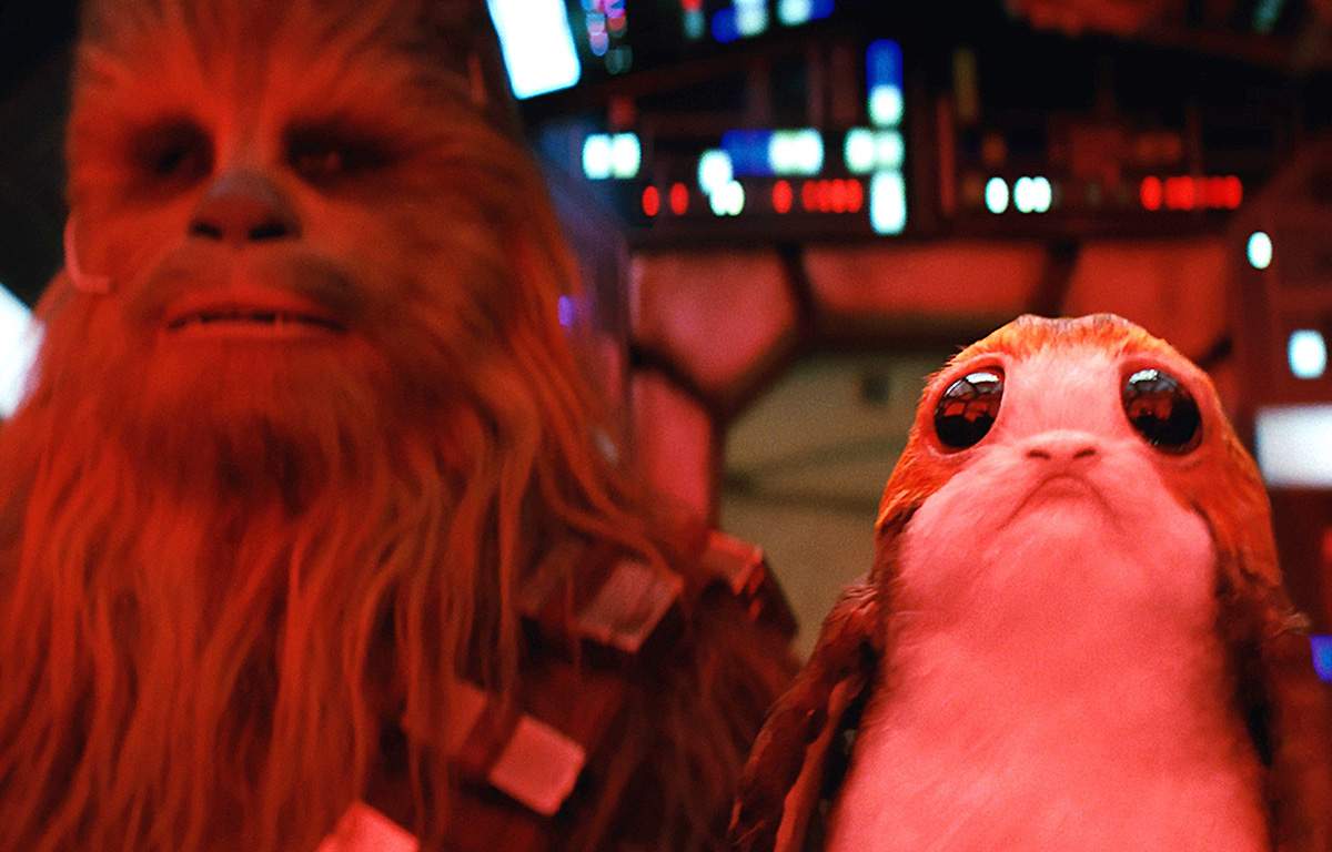 Chewbacca and a porg are seen in a scene from ‘The Last Jedi.’