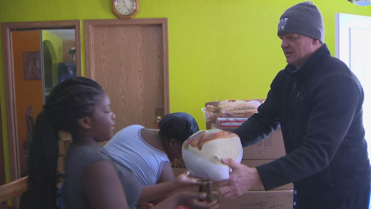 Wilson gives a family in need their Christmas turkey.