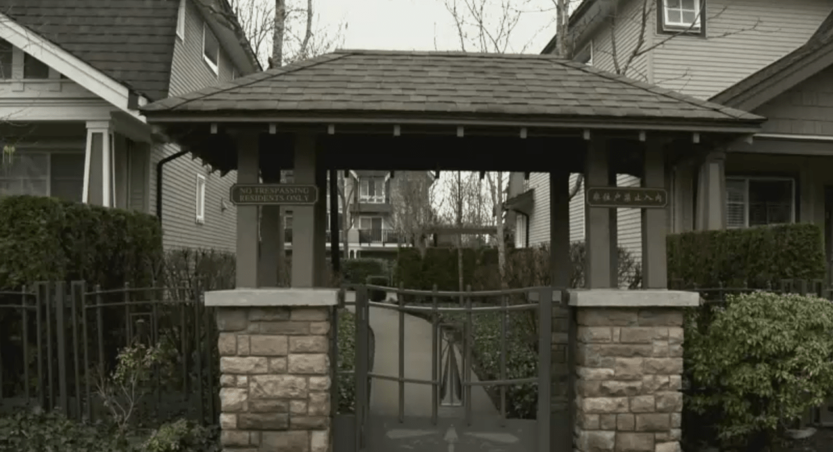 A gate at Wellington Court, a complex at the centre of a battle over Mandarin-only strata meetings.