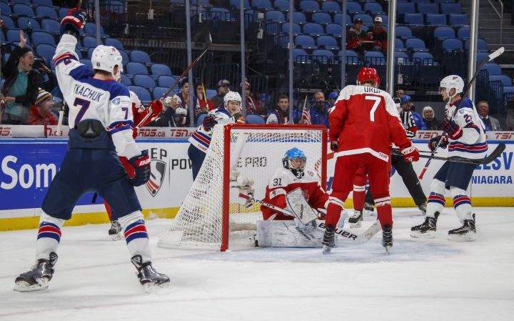 USA's Kailer Yamamoto, centre back, celebrates his goal against Denmark's Kasper Krog, centre, with teammates Brady Tkachuk, left, and Logan Brown, right, during the first period of IIHF World Junior Championship preliminary round hockey action in Buffalo, N.Y. Tuesday December 26, 2017. 