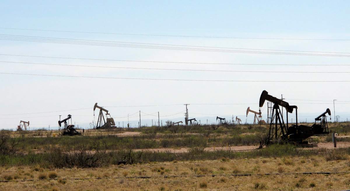This April 9, 2014, photo shows oil rigs in the Loco Hills field in Eddy County, near Artesia, New Mexico, one of the most active regions of the Permian Basin.
