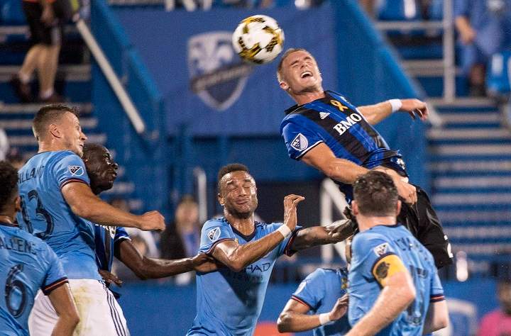 Montreal Impact defender Kyle Fisher heads the ball towards the New York City FC net during first half MLS action Wednesday, September 27, 2017 in Montreal. 