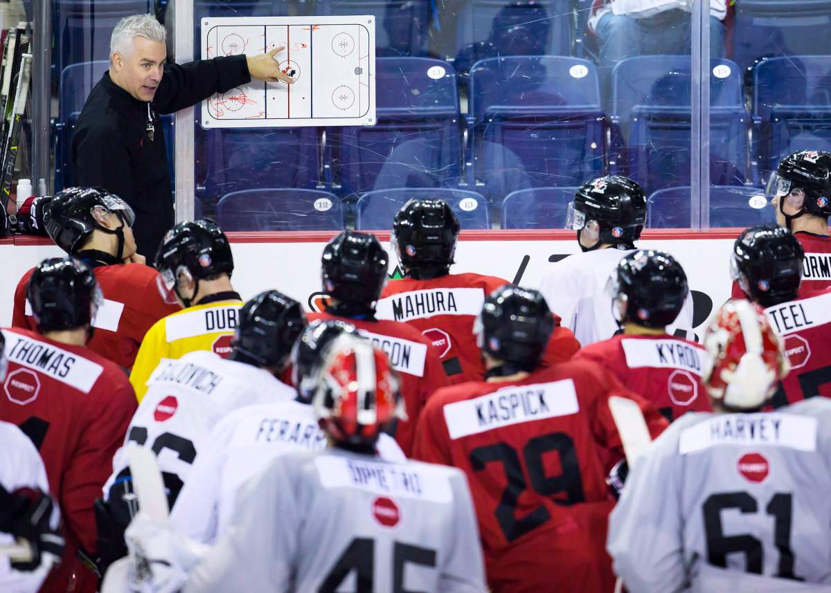 Canadian national junior team head coach Dominique Ducharme outlines a drill on the first day of selection camp for the 2018 World Junior Hockey Championship in St.Catharines, Ont., Tuesday, December 12, 2017.