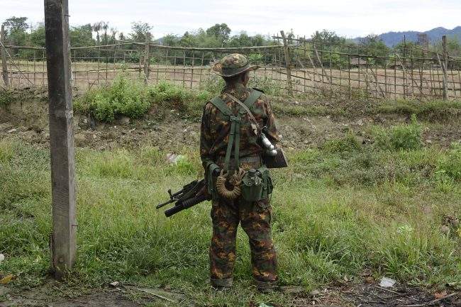 An armed soldier stand guards in Maungdaw township, Rakhine State, western Myanmar, 02 January 2018.