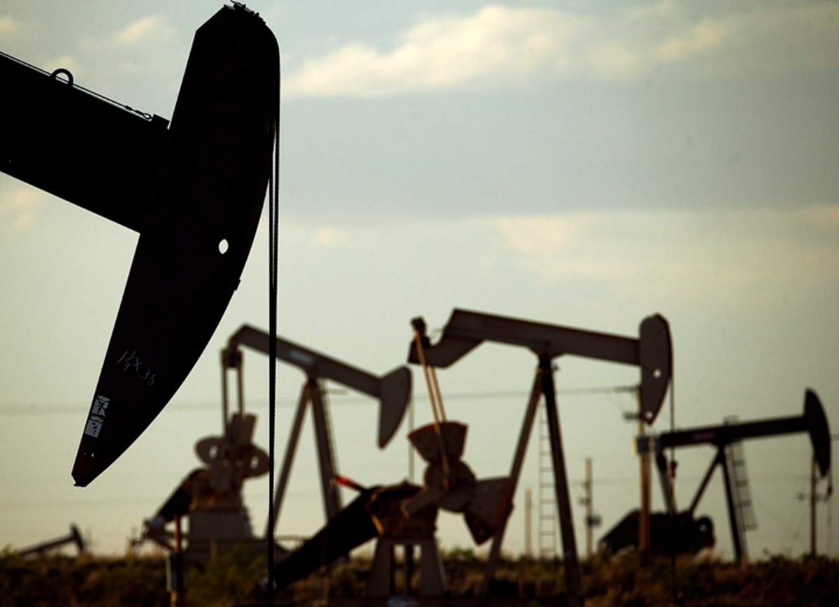 FILE - In this April 24, 2015 file photo, pumpjacks work in a field near Lovington, New Mexico.