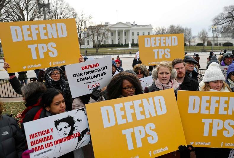 CASA de Maryland, an immigration advocacy and assistance organization, holds a rally in Lafayette Park, across from the White House in Washington, Monday, Jan. 8, 2018, in reaction to the announcement regarding Temporary Protective Status for people from El Salvador.