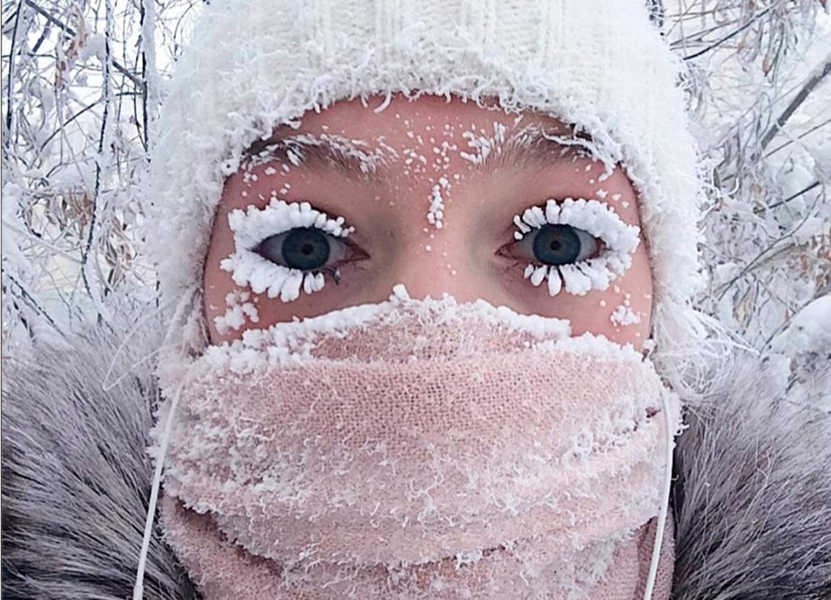 In this photo taken on Sunday, Jan. 14, 2018, Anastasia Gruzdeva poses for selfie as the Temperature dropped to about -50 degrees (-58 degrees Fahrenheit) in Yakutsk, Russia.