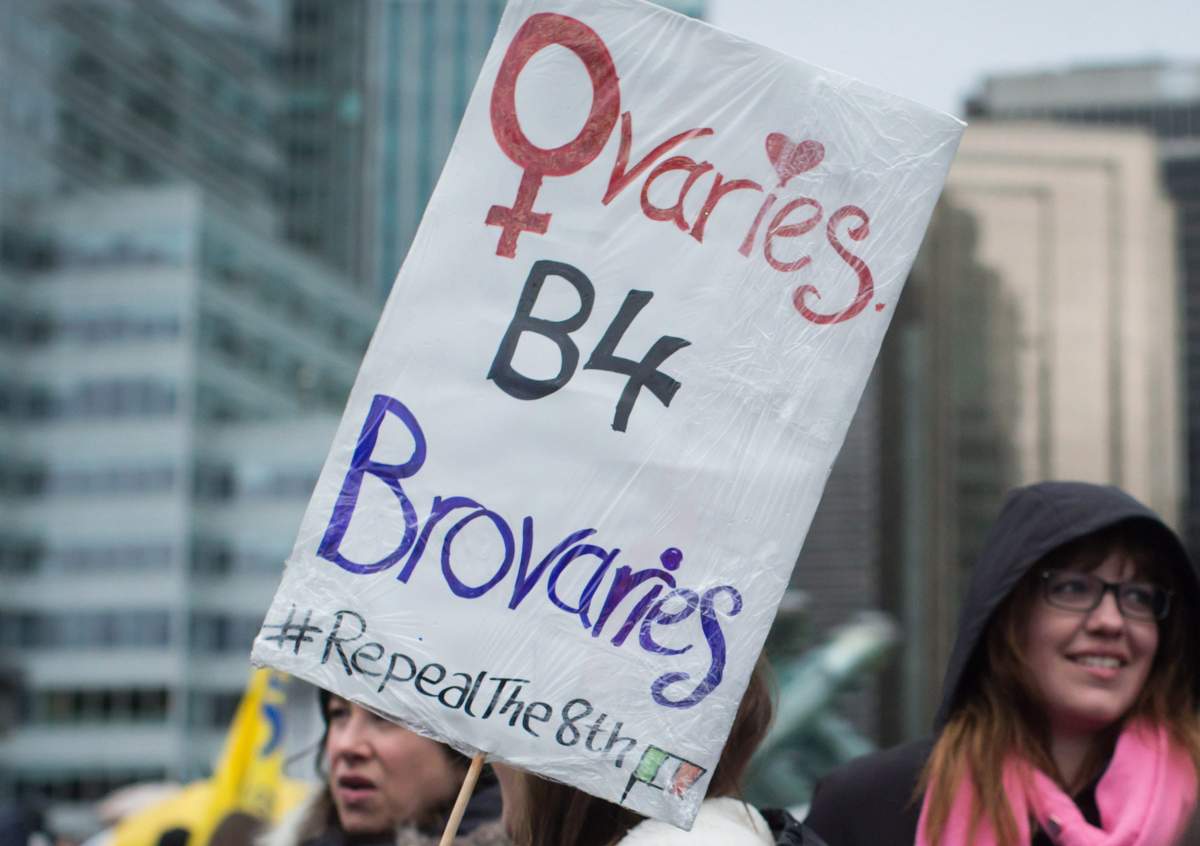 A woman holds a sign as thousands of people attend a women’s march in Vancouver, B.C., on Saturday January 20, 2018.