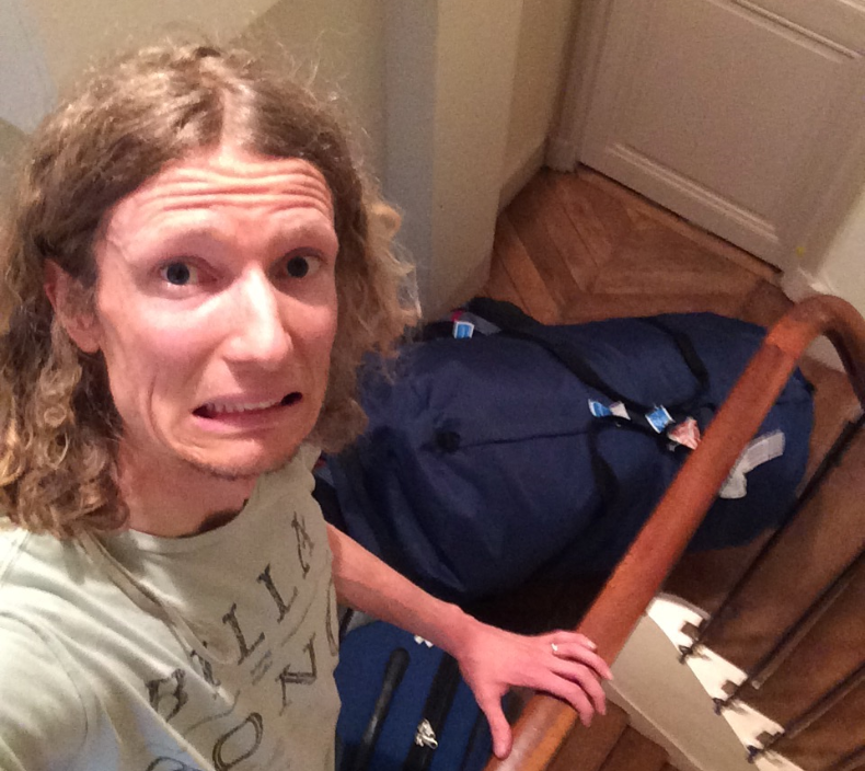 Travel blogger Asher Fergusson, pictured above, says he had to climb six flights of stairs carrying luggage and baby gear only to find out that his Airbnb Paris rental was a scam. 