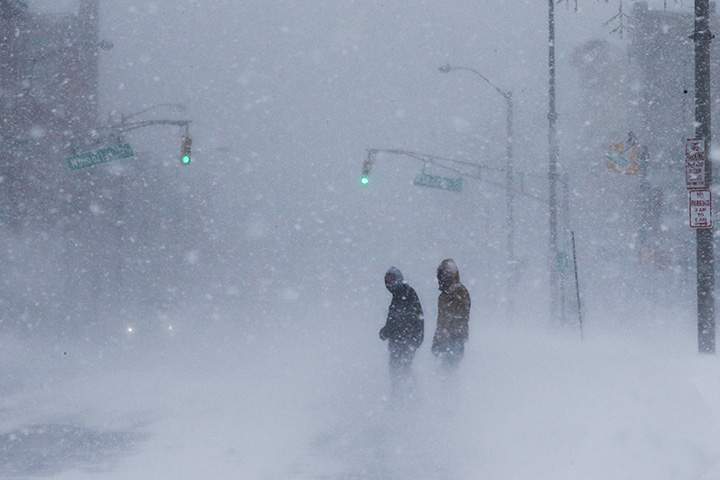People struggle against wind and snow during the Jersey Shore in Long Branch, Jan. 4, 2018.