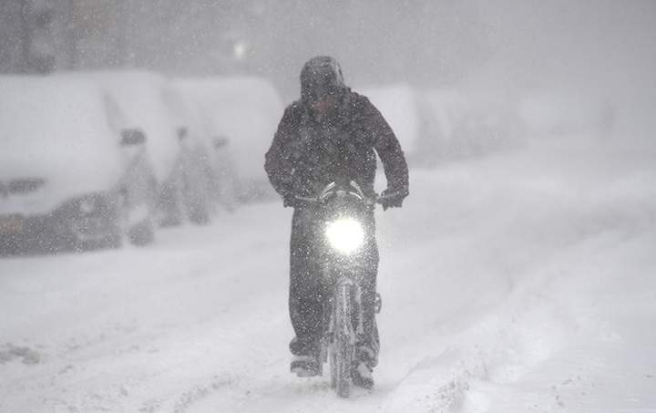 A man rides a bicycle on January 4, 2018 in Brooklyn, New York.