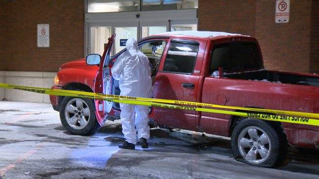 Authorities examine the vehicle which was used to transport the victim to hospital.