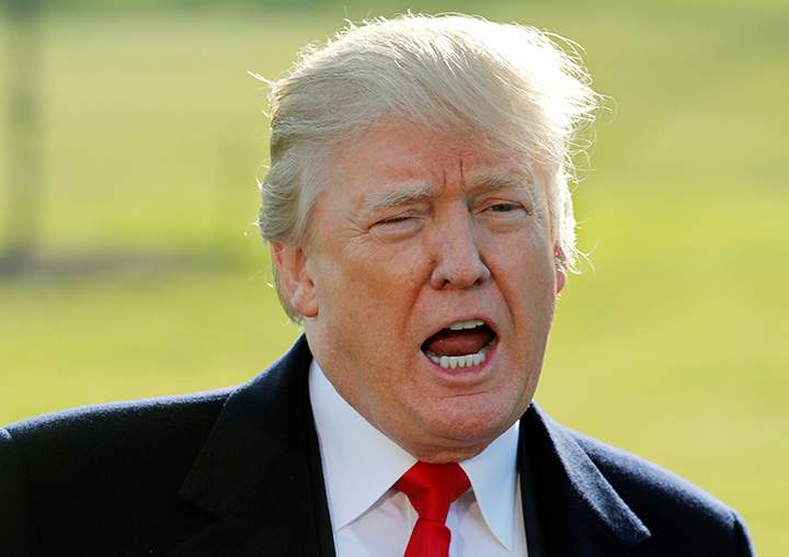 U.S. President Donald Trump talks to reporters before in Washington, DC, December 21, 2017.   