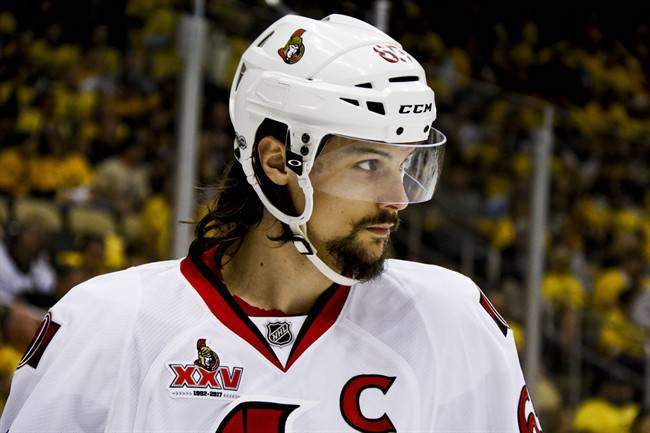 FILE - In this May 16, 2017, file photo, Ottawa Senators' Erik Karlsson prepares for a face-off during the second period of Game 2 of the Eastern Conference finals against the Pittsburgh Penguins, in Pittsburgh.