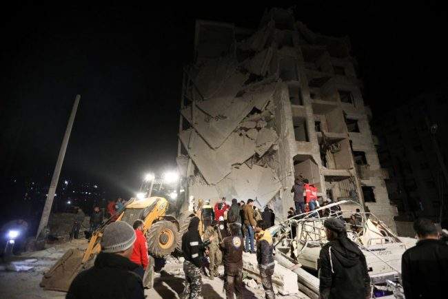 Syrian emergency personnel search for victims following an explosion in a rebel-held area of the northwestern city of Idlib on Jan. 7, 2018.