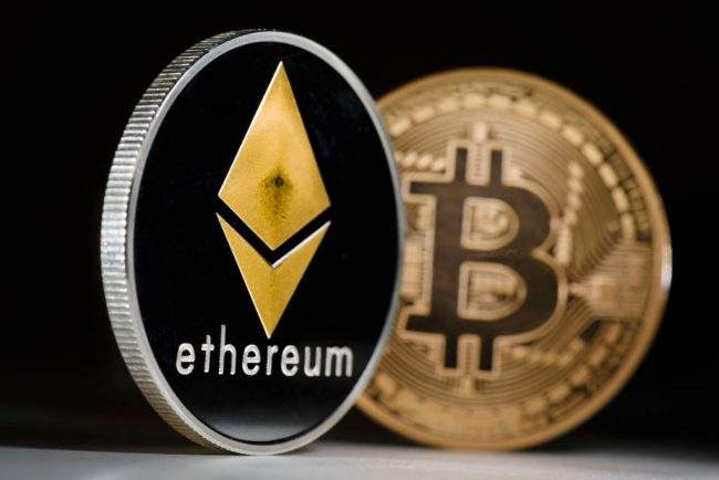 Berlin, Germany - January 09: Coins of the cryptocurrencies Ethereum and Bitcoin stands on a table on January 09, 2018 in Berlin, Germany. (Photo by Thomas Trutschel/Photothek via Getty Images).