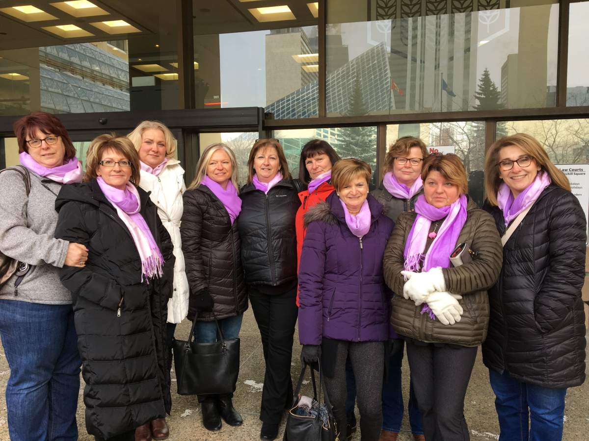 Gina Robinson’s friends attend court for her estranged husband’s murder trial. The purple scarves signify Gina’s favourite colour and raise awareness for domestic violence.