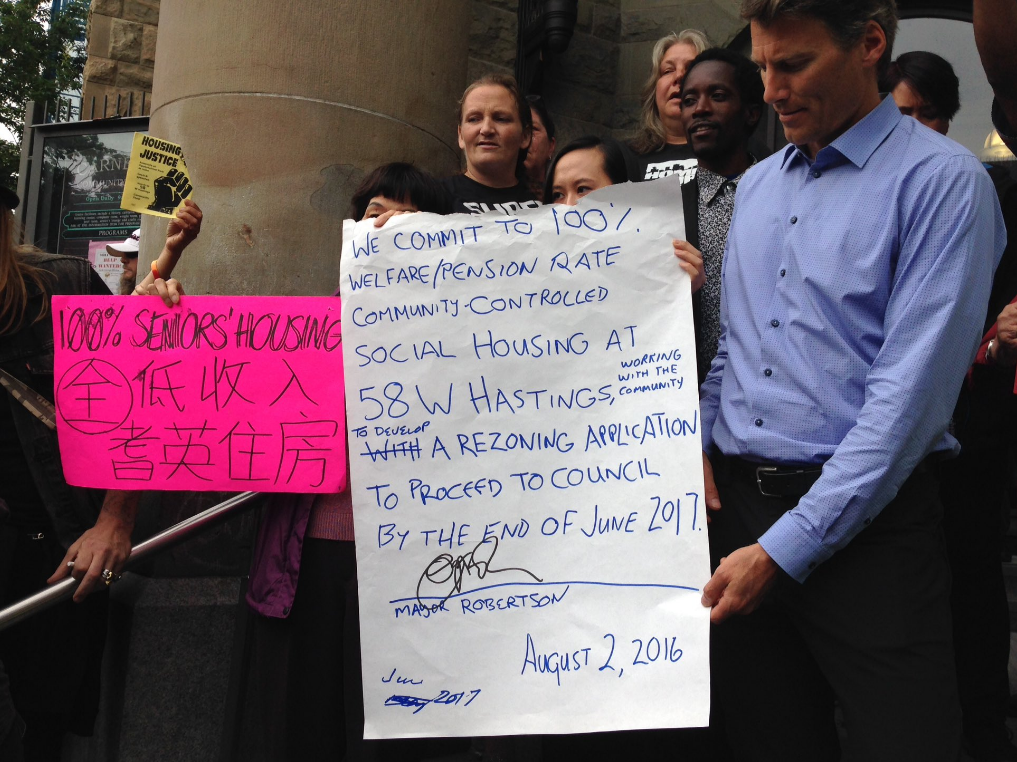 Former Vancouver Mayor Gregor Robertson meeting with housing activists about 58 W. Hastings in 2016.