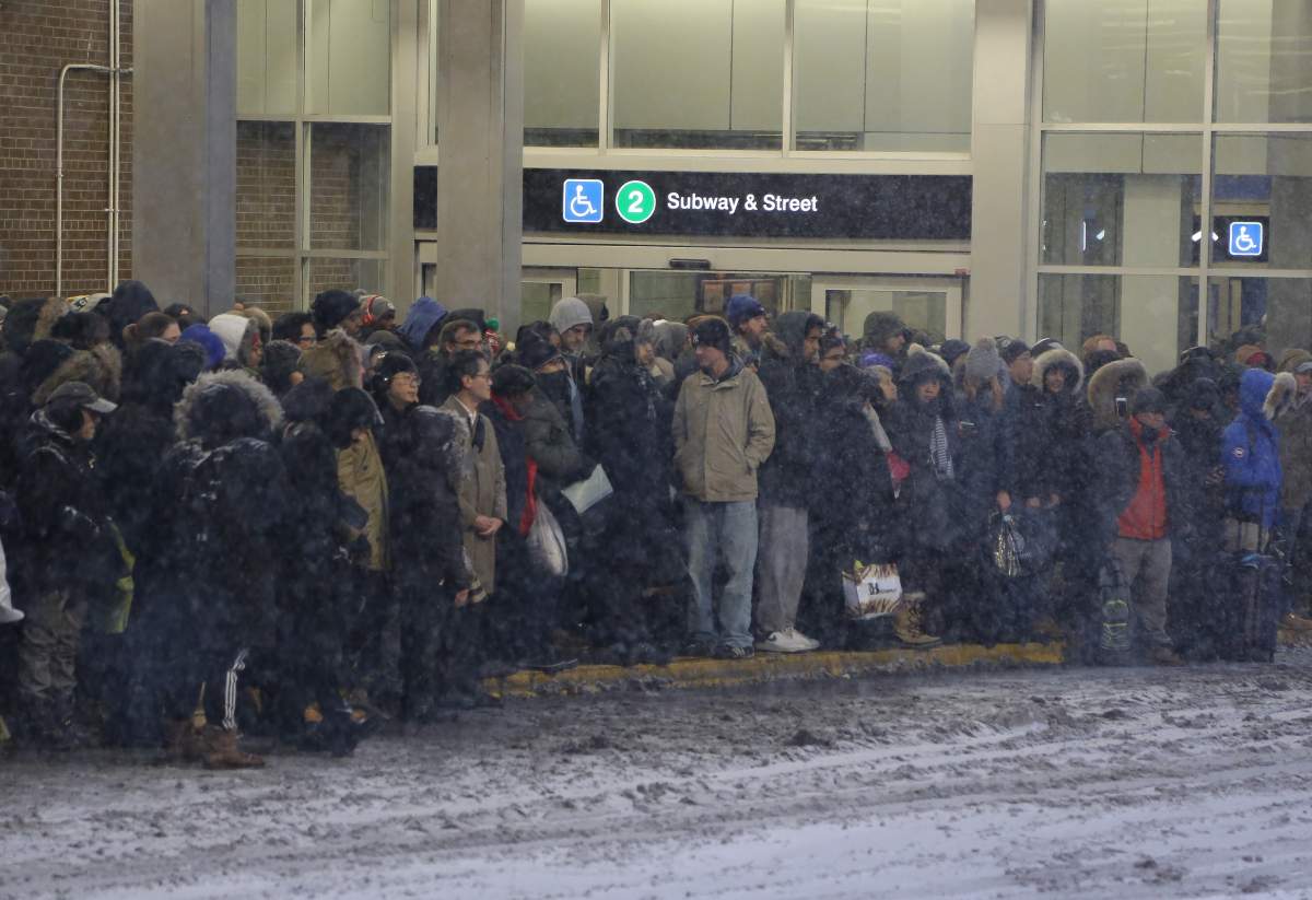 Commuters wait for shuttle buses at Woodbine Station following a power outage on Jan. 8, 2018.