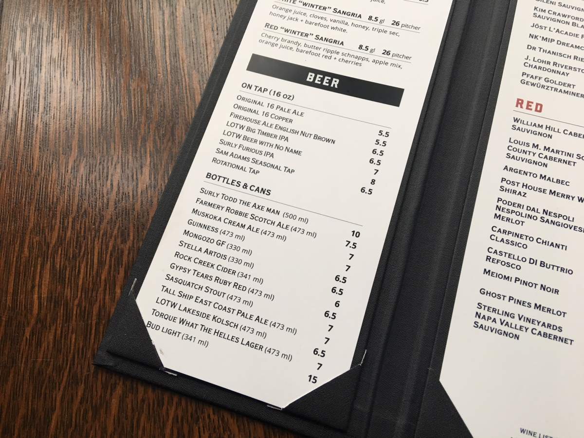 Prairie Firehouse’s beer menu featuring Bud Light cans for $15.