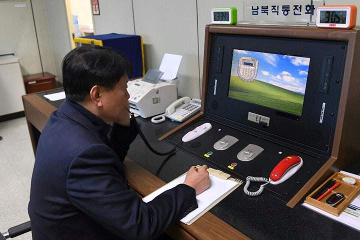 A South Korean government official checks the direct communications hotline to talk with the North Korean side at the border village of Panmunjom, South Korea, Jan. 3, 2018.