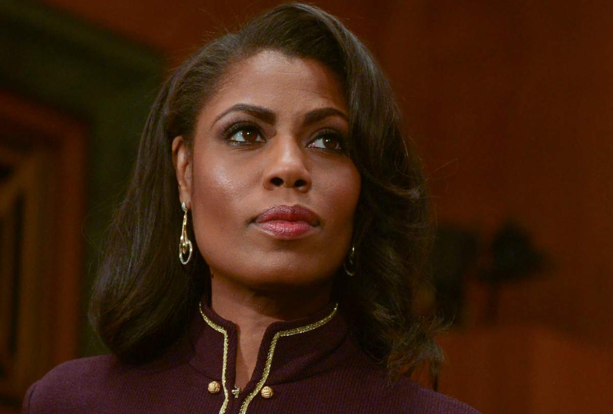 Omarosa Manigault Newman listens as Ben Carson testifies before a Senate Banking, Housing and Urban Affairs Committee on January 12, 2017 in Washington, DC.
